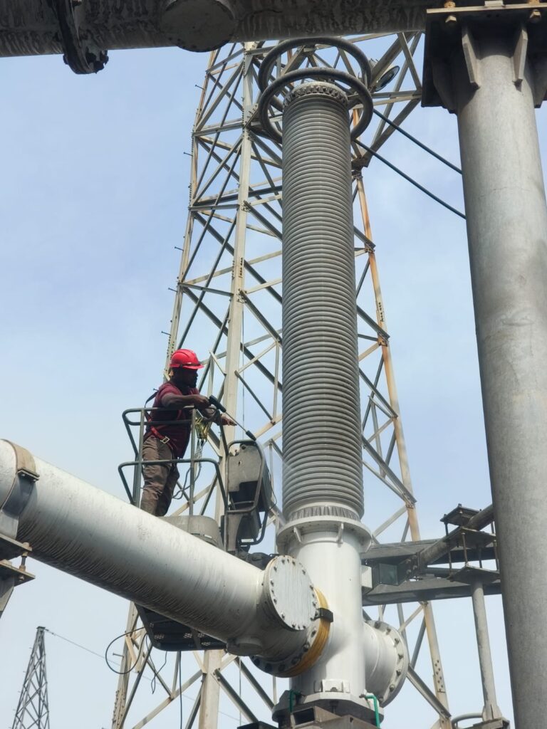 Engineer Applying Silicone Insulation Coating